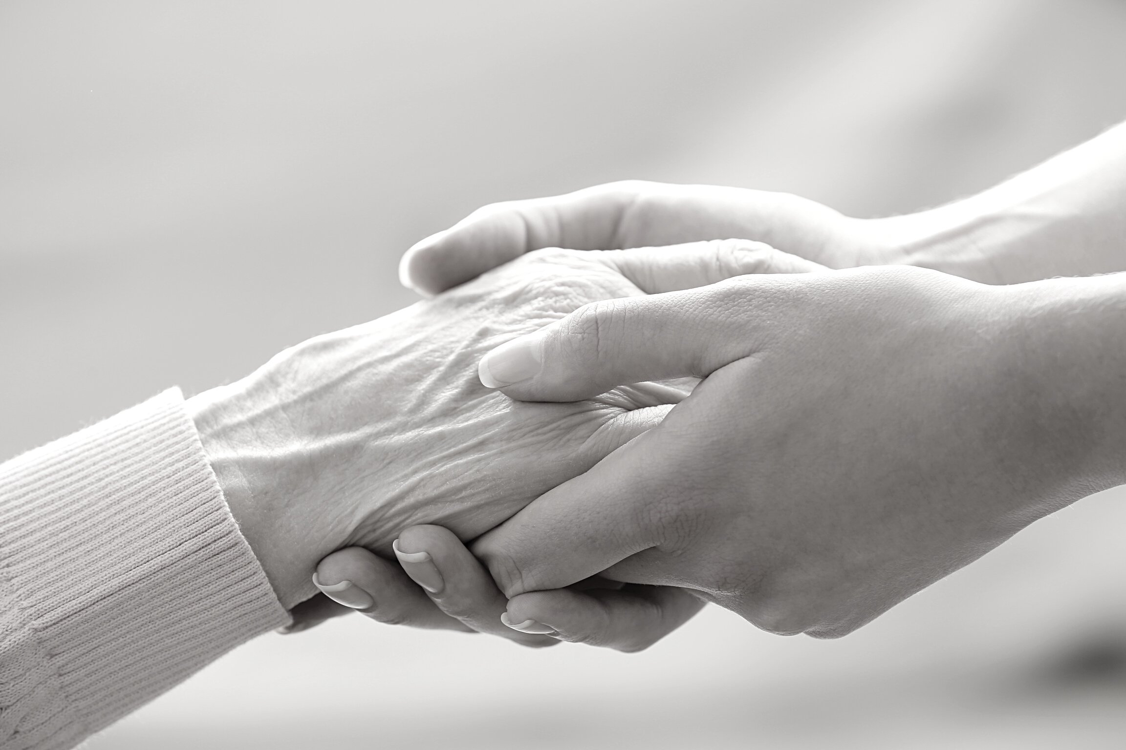 Young Hands Holding Elderly Hands